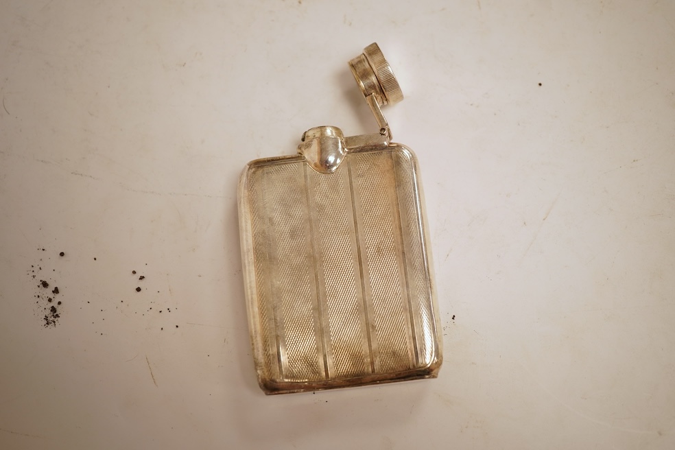 A George V engine turned silver hip flask, William Neale Ltd, Birmingham, 1924, 92mm, 89 grams.